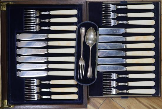 A cased set of silver and ivory fish knives and forks and cased christening set